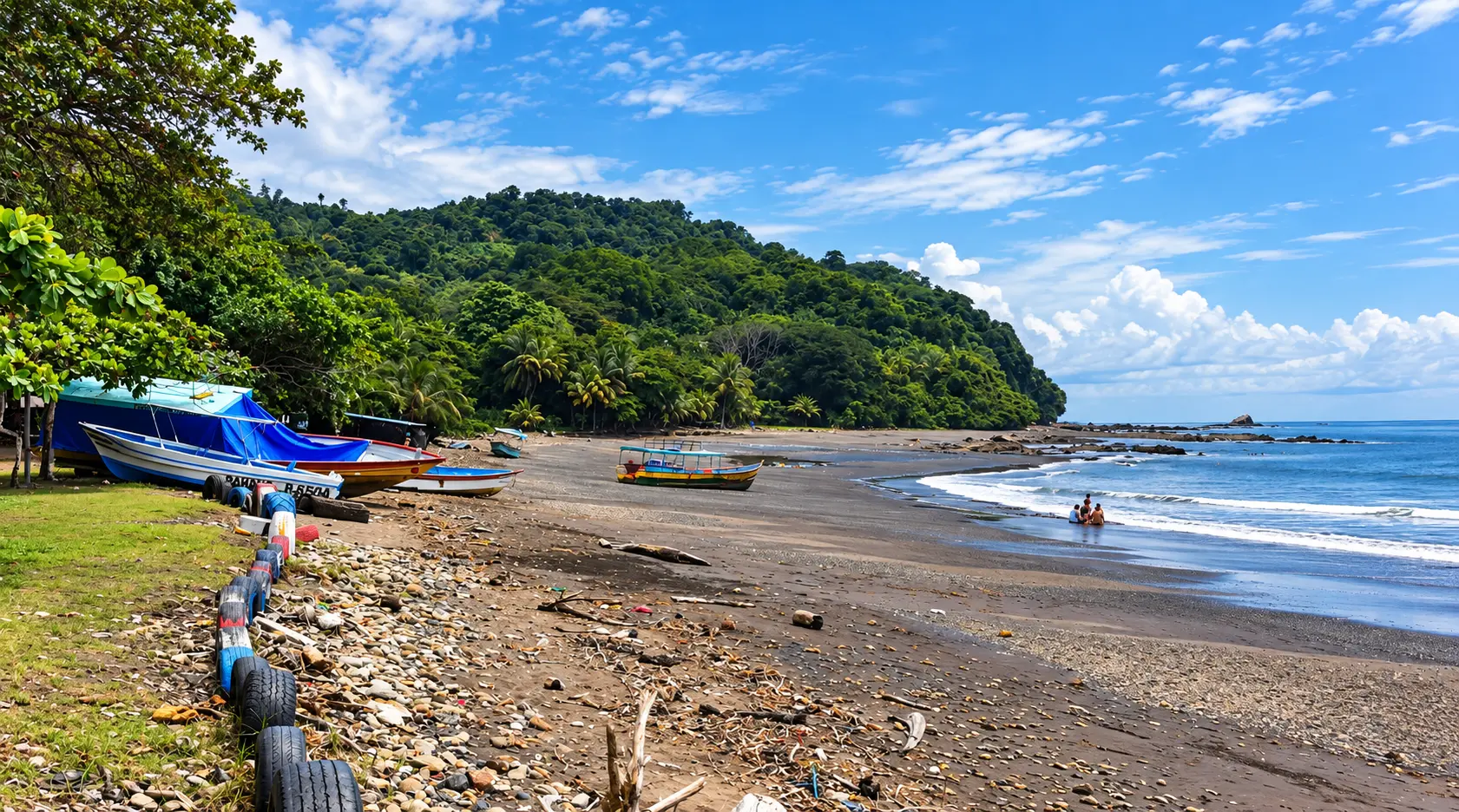Playa Pita: fishing boats resting on a dark sand beach